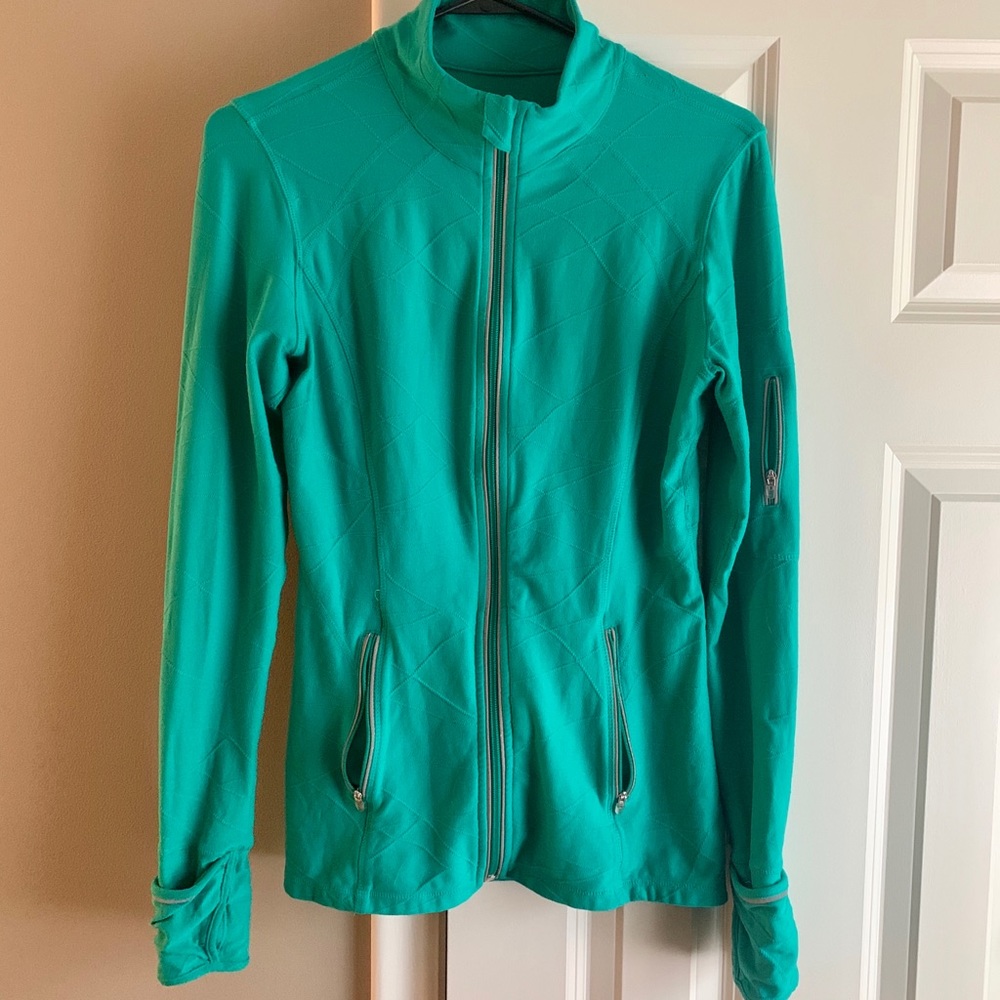 Kirkland Signature green athletic jacket